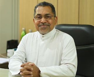 Dr. Charles Lasrado SJ